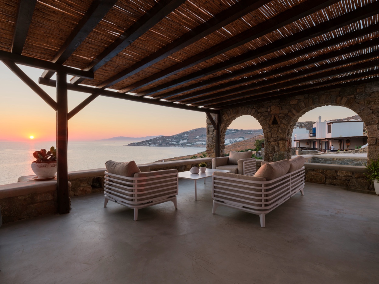 Evening terrace at sunset with stone arch