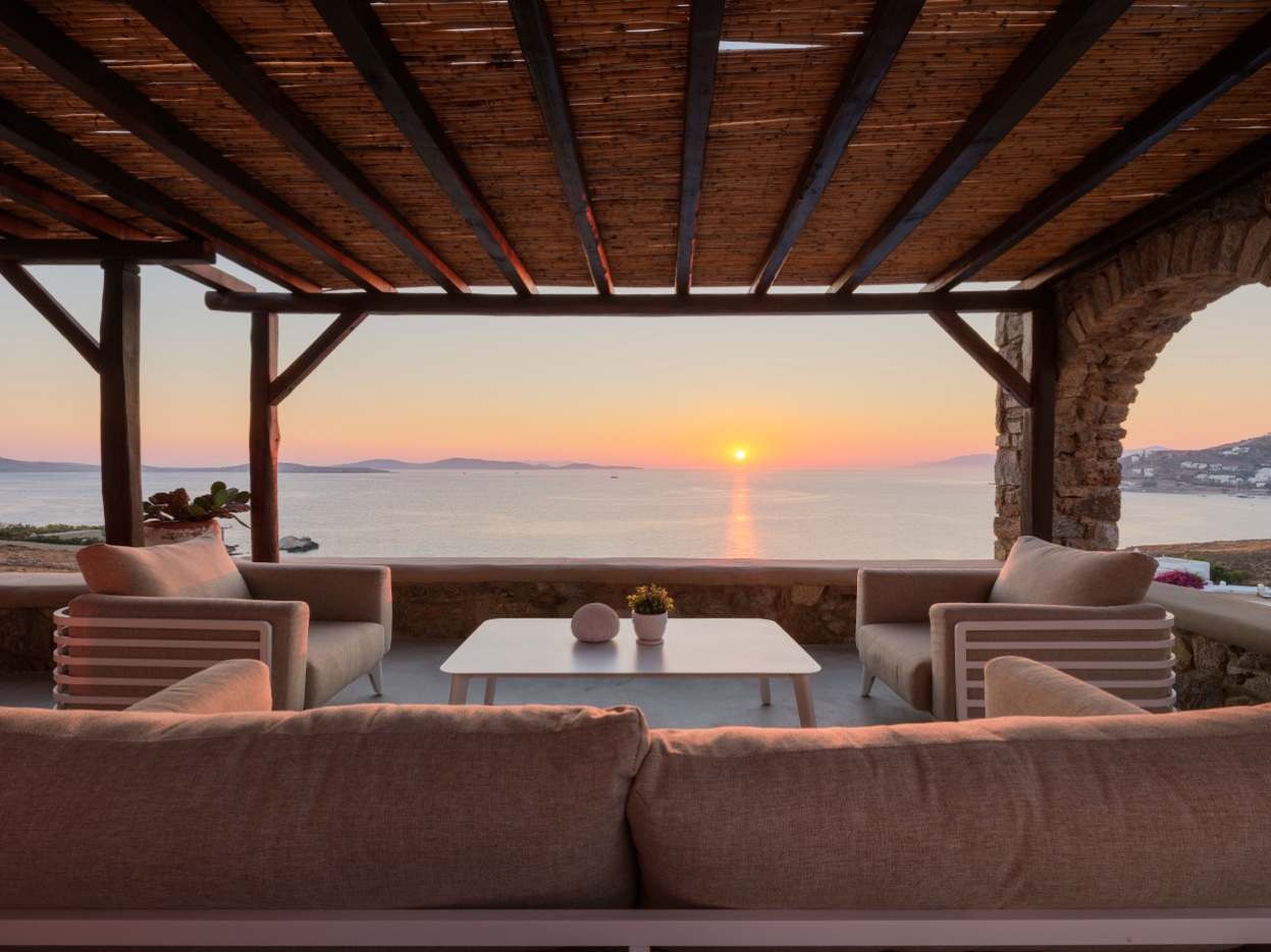 Perfectly framed Aegean sunset through Salty Ble terrace